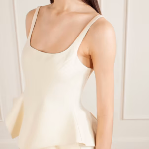 KHAITE Loa linen peplum top